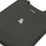 a folded black monumental clothing sweatshirt with a white logo on the center of the chest.